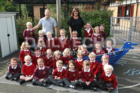 Reception children in Honeybees class at  Lytchett Matravers Primary School with Teacher  Tony Maguire, left, and TA Anita Coombs