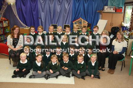Reception Children in Stars class at Ad Astra Infant School with  Teacher Miss Walker, left, and TA's Miss Cobb and Mrs Thornton