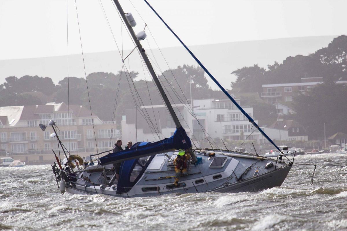 See all Daily Echo and reader pictures of damage left behind after St Jude hits Dorset. The RNLI rescuing the yacht 'Spirit of Kent' which ran aground in Poole Harbour. Picture by Malcolm Barents.