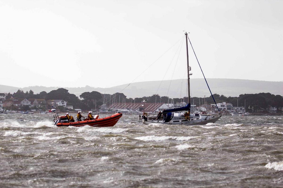 See all Daily Echo and reader pictures of damage left behind after St Jude hits Dorset.  The RNLI rescuing the yacht 'Spirit of Kent' which ran aground in Poole Harbour. Picture by Malcolm Barents.