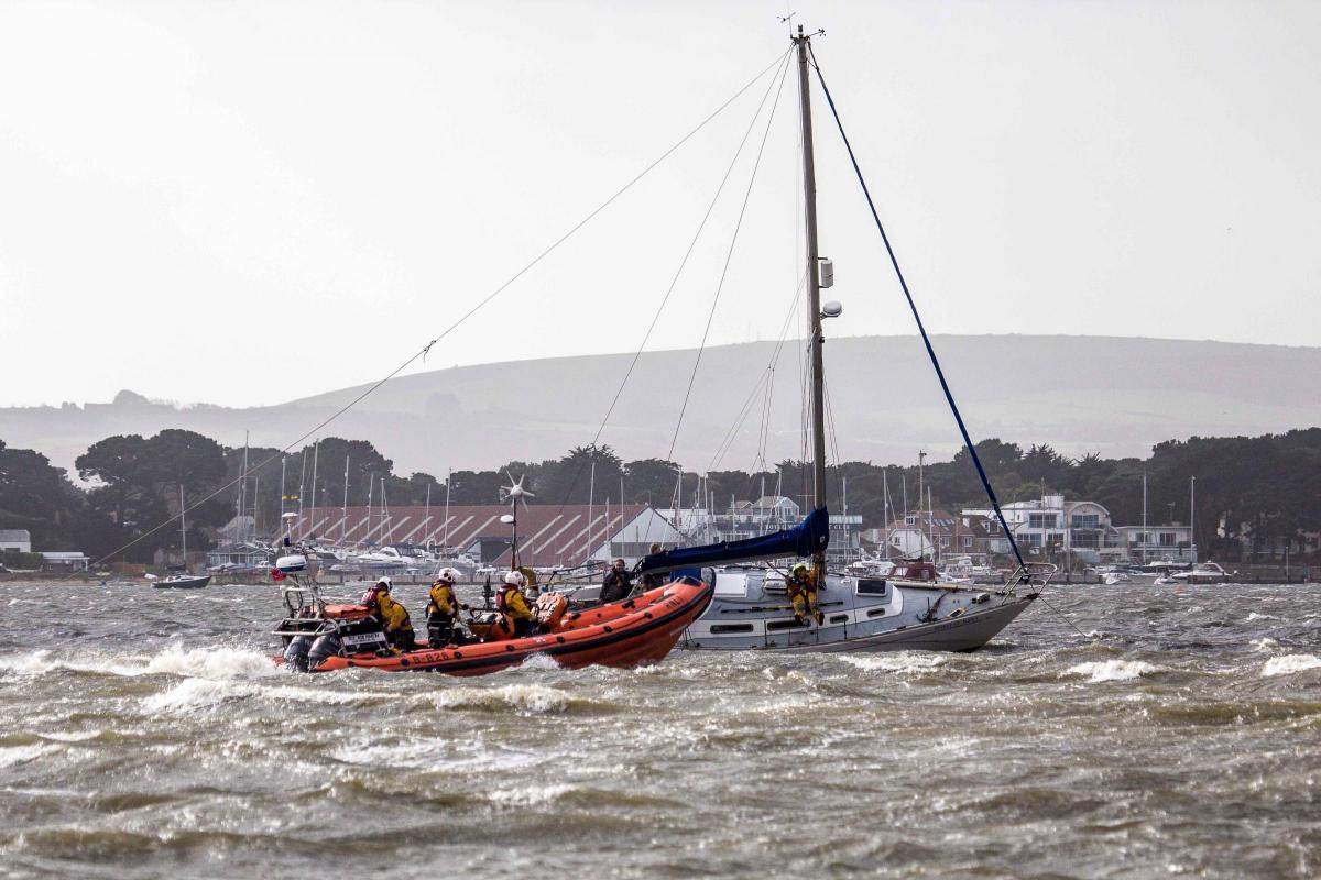 See all Daily Echo and reader pictures of damage left behind after St Jude hits Dorset.  The RNLI rescuing the yacht 'Spirit of Kent' which ran aground in Poole Harbour. Picture by Malcolm Barents.