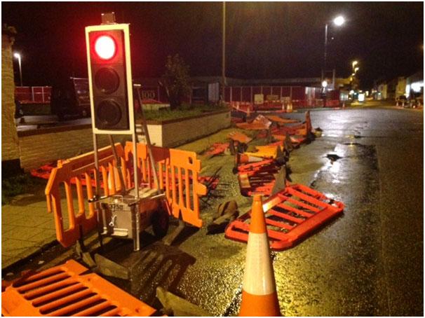 See all Daily Echo and reader pictures of damage left behind after St Jude hits Dorset. Roadworks barriers down in Purewell.