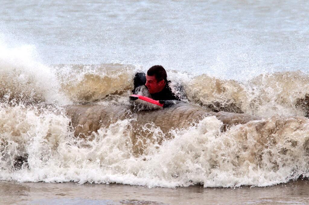 See all Daily Echo and reader pictures of damage left behind after St Jude hits Dorset. A bodyboarder in Swanage enjoys the waves.