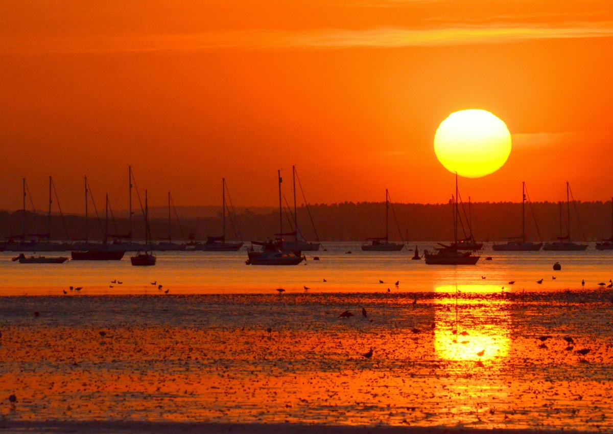 Sunset at Sandbanks into Poole Harbour by Martyn Jenkins