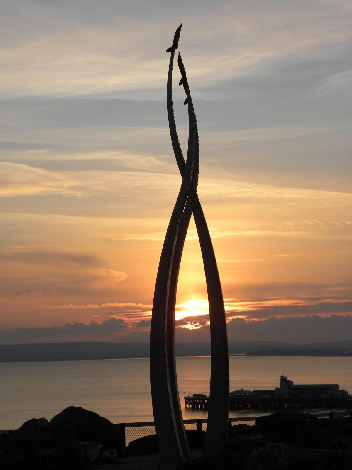 Setting Sun behind the  Jon Egging  memorial from Bournemouth East Overcliff Drive taken by Anthony Oliver
