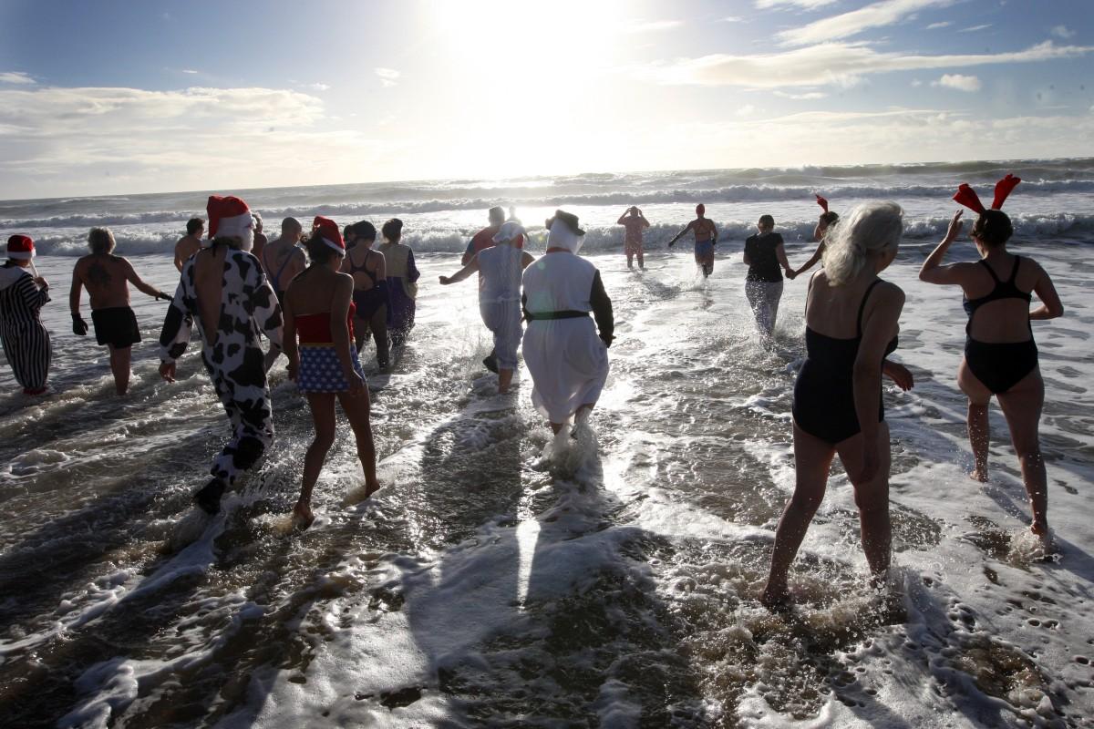 Members of the Spartans sea swimming club   take part in their annual Christmas Day  swim on Boscombe  sea front.
