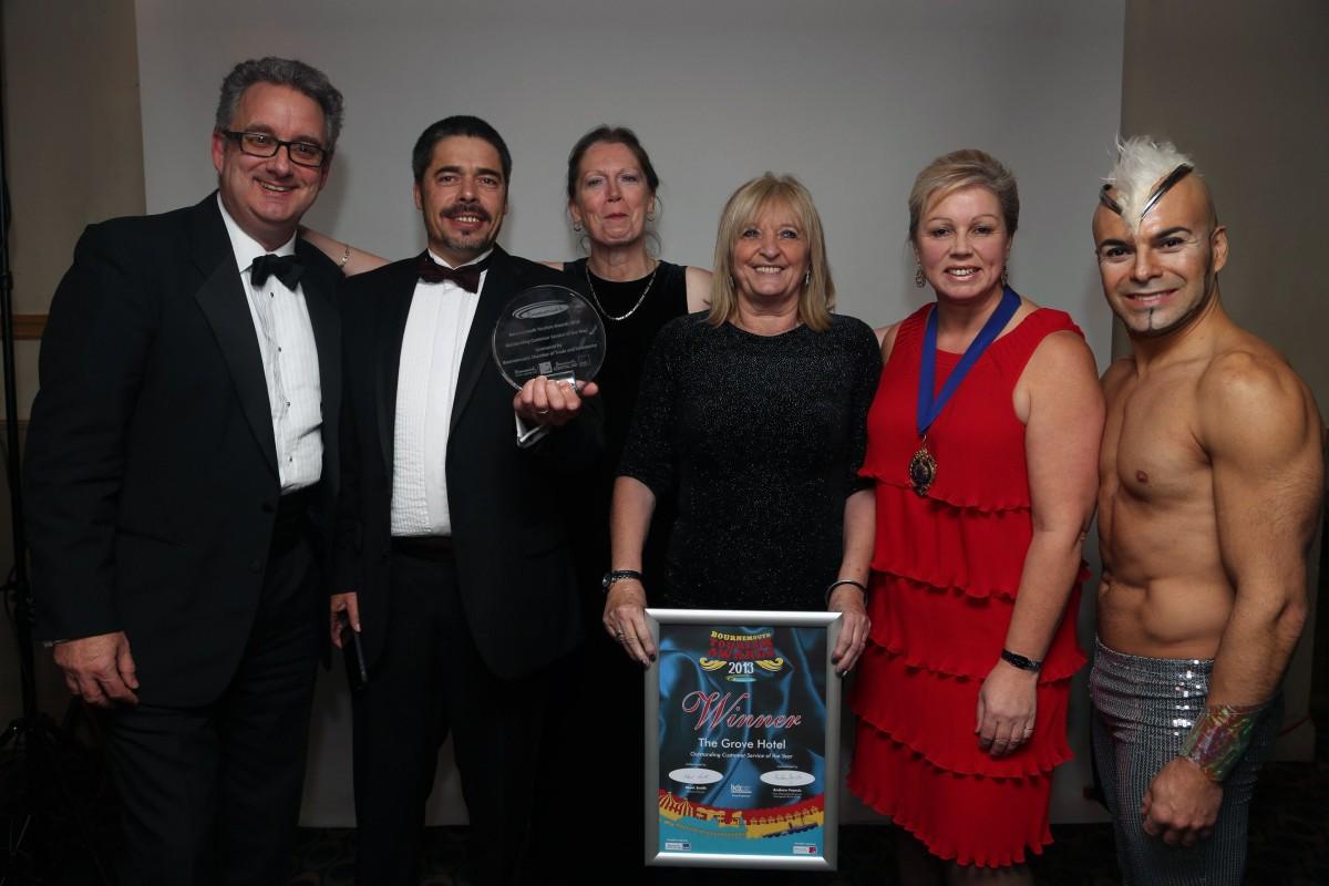 The Grove Hotel, Outstanding Customer Service Award Winners, at the Bournemouth Tourism Awards 2013. Neal Williams, Brenden Howard, Jennett Mcgetrick, Lesley Telford, and Sponsor Mandy Payne, President of the Bournemouth Chamber of Trade and Commerce. 