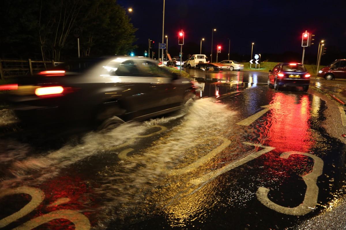 Pictures taken by Daily Echo photographers and readers after heavy rain and strong winds hit Dorset on December 23 and 24, 2013. Flooding at Canford Bottom Roundabout
