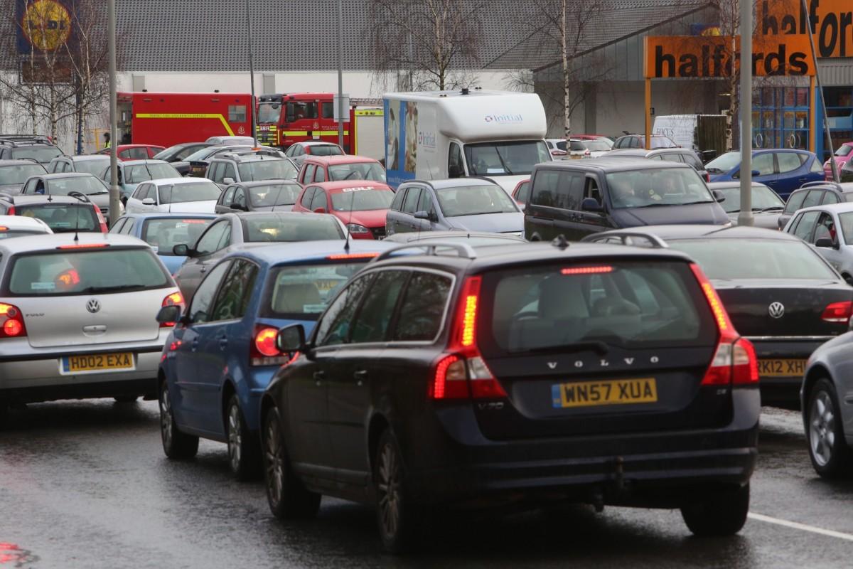 Pictures taken by Daily Echo photographers and readers after heavy rain and strong winds hit Dorset on December 23 and 24, 2013. Traffic on the A348 Ringwood Road. Residents at the nearby Gladelands Caravan Park had to be evacuated due to flooding. 