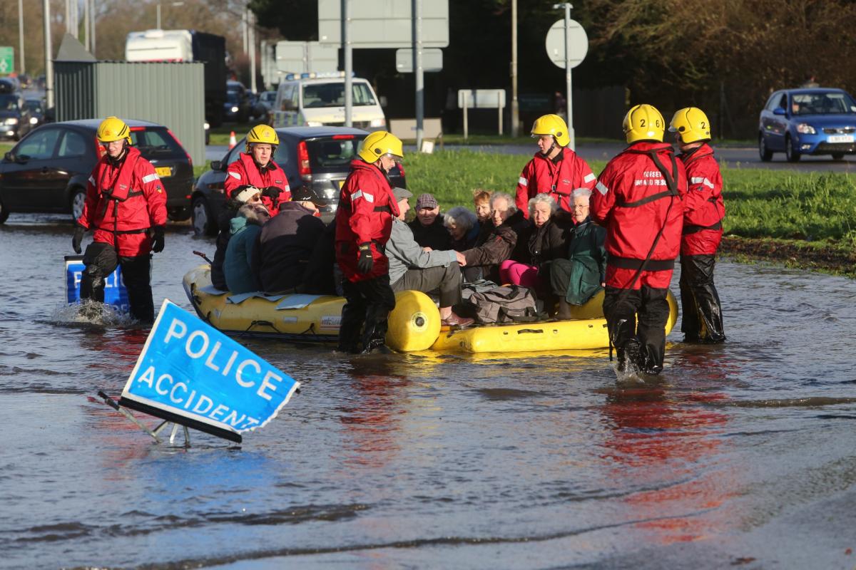 Pictures taken by Daily Echo photographers and readers after heavy rain and strong winds hit Dorset on December 23 and 24, 2013.  Residents evacuated from the Gladelands Caravan Park near Ferndown by boat.