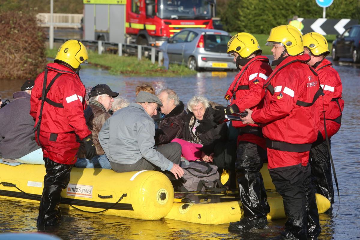 Pictures taken by Daily Echo photographers and readers after heavy rain and strong winds hit Dorset on December 23 and 24, 2013. Residents evacuated from the Gladelands Caravan Park near Ferndown by boat.