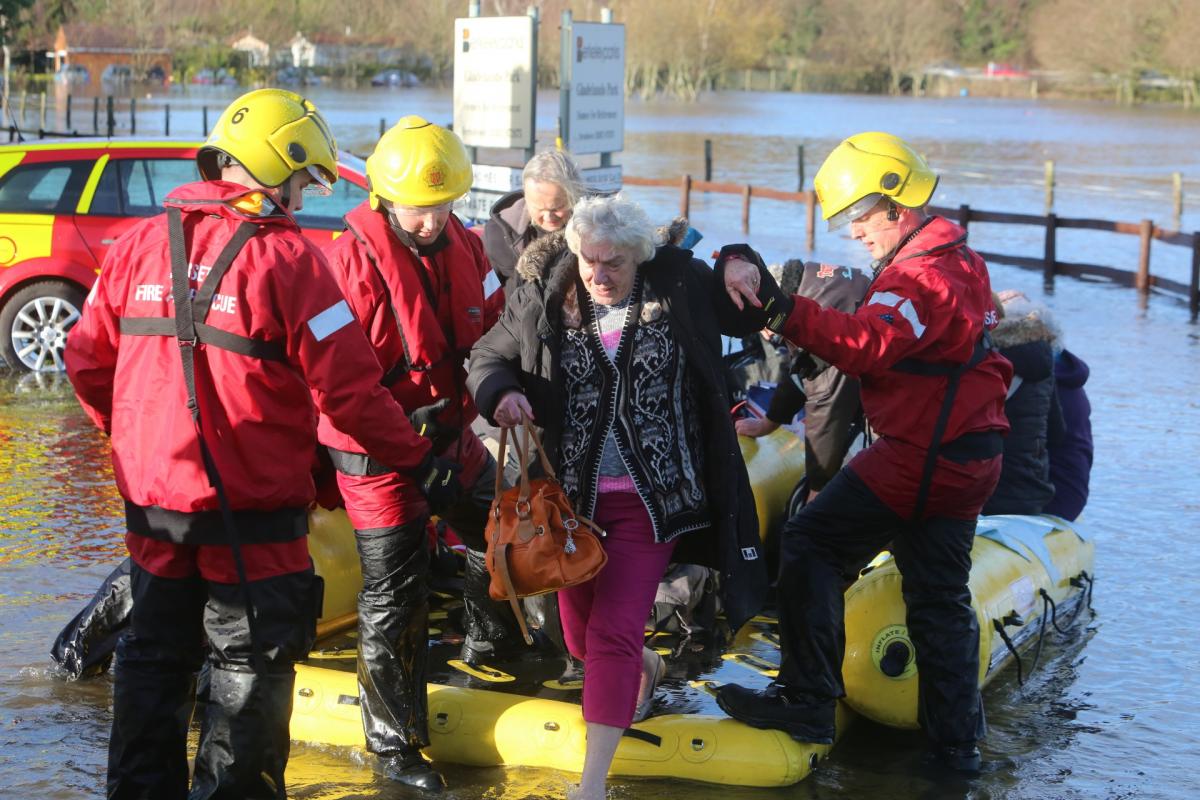 Pictures taken by Daily Echo photographers and readers after heavy rain and strong winds hit Dorset on December 23 and 24, 2013. Residents evacuated from the Gladelands Caravan Park near Ferndown by boat.