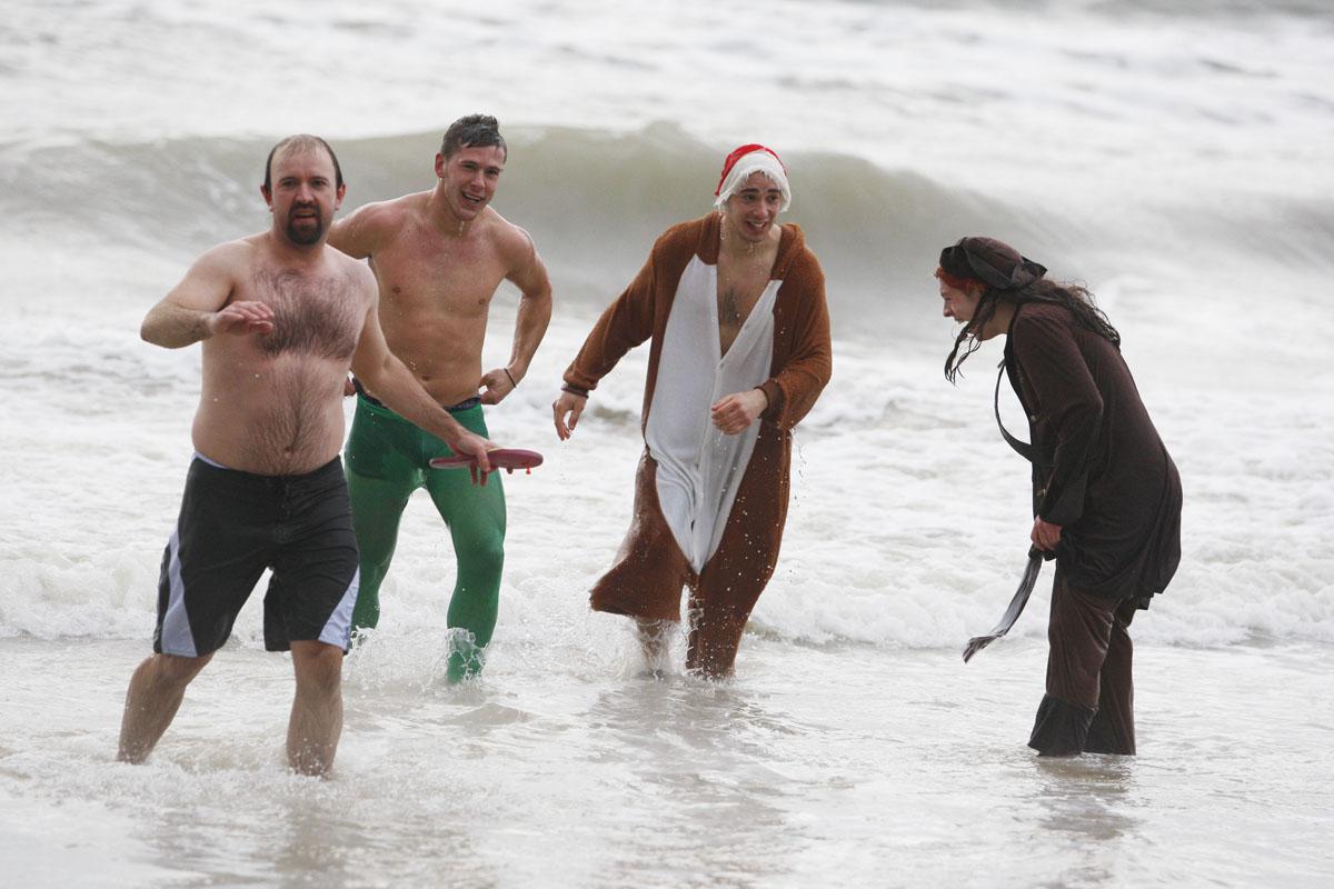 All our pictures from the annual White Christmas Dip 2013 at Boscombe Pier on Christmas Day. The event is in aid of Macmillan Caring Locally. 