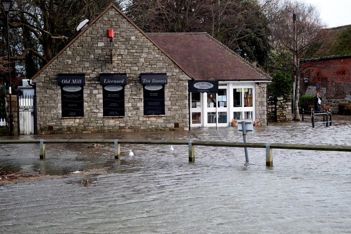 Heavy rain and strong winds cause flooding and high tides across Dorset. High Tide at Christchurch Quay.