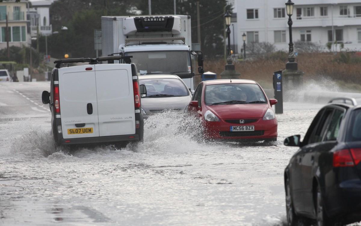 Heavy rain and strong winds cause flooding and high tides across Dorset. High Tide and heavy rain brings flooding to Shore Road in Poole.