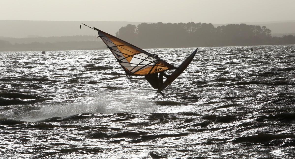 Heavy rain and strong winds cause flooding and high tides across Dorset. High Tide and heavy rain makes for excellent  windsurfing  conditions off Hamworthy Park