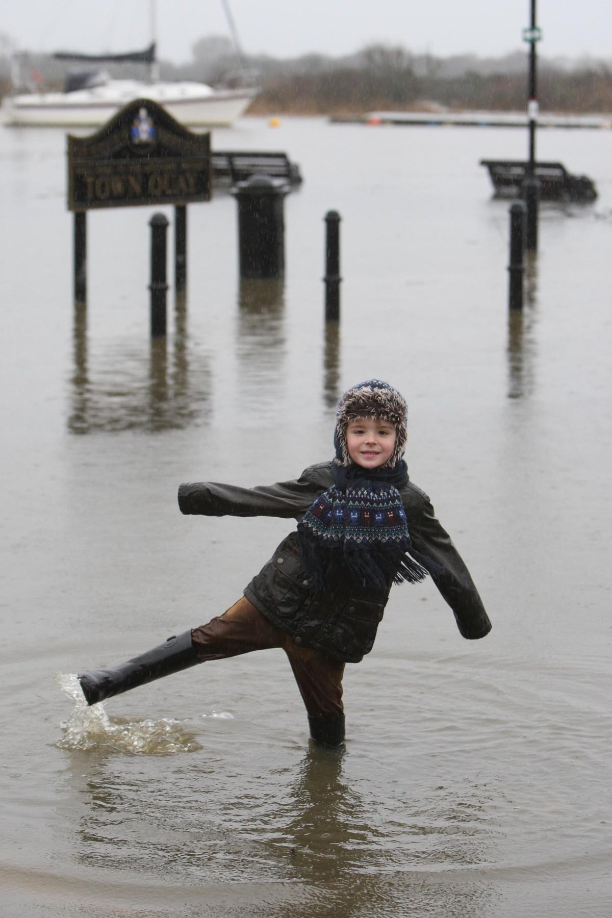 Heavy rain and strong winds cause flooding and high tides across Dorset. Jack Olley,5, finds the water's not quite over his wellies at Christchurch Quay.