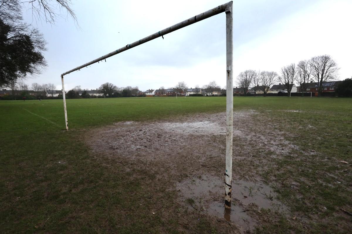 Heavy rain and strong winds cause flooding and high tides across Dorset.  Waterlogged pitches at Fernheath Rec.