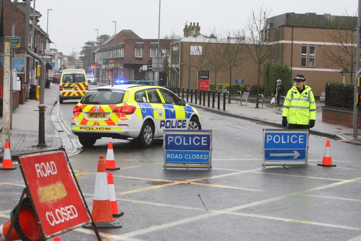 Police close part of Lymington Road in Highcliffe after pavements crack caused by flood water building up in a drain.