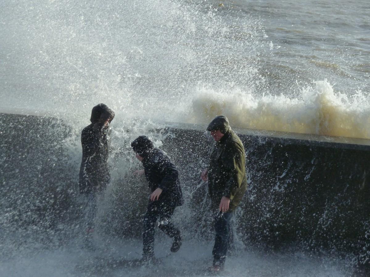Daily Echo photographers and readers braved the stormy weather to capture these moments across Dorset. Wavewatchers at Mudeford Quay. Picture by Mick Robinson 