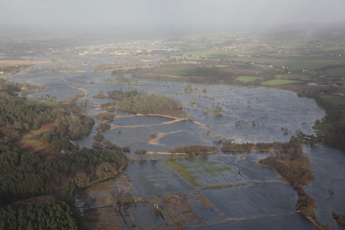 Daily Echo photographers and readers braved the stormy weather to capture these moments across Dorset. Aerial picture of flooding looking North towards Ringwood. Picture by Gary Ellson, Bournemouth Helicopters