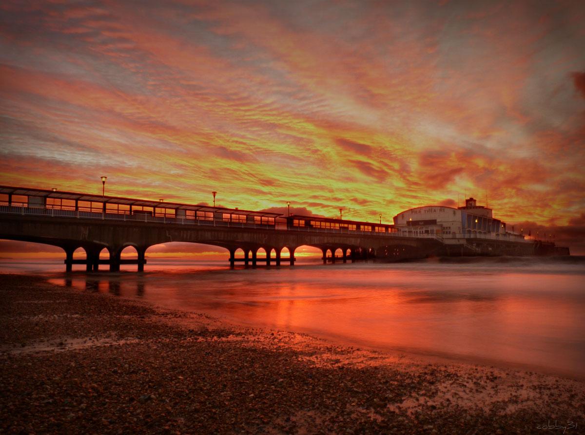 Daily Echo photographers and readers braved the stormy weather to capture these moments across Dorset.  Sunrise at Bournemouth Pier on Sunday, January 5.Picture by Paul Cobb.