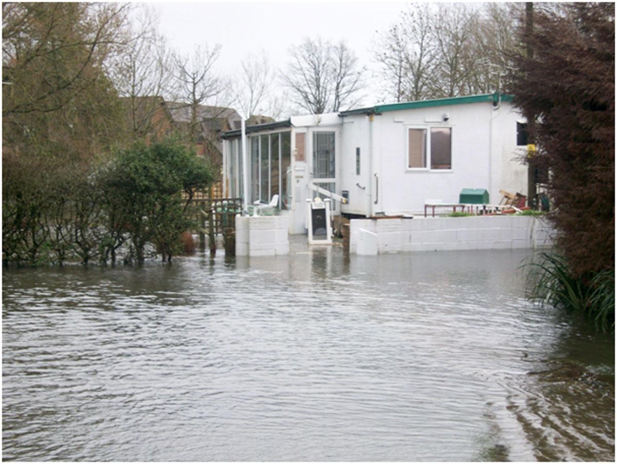 Daily Echo photographers and readers braved the stormy weather to capture these moments across Dorset. Floodwater surrounds a mobile home in Ringwood. Picture by Tim Baber.