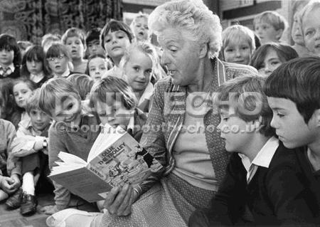Helen Solomon, author and Ferndown Maypress opened a bookshop at Townsend Primary School, Bournemouth. She reads from her book 'Ollie the Trolley' to the children. 14/10/1985