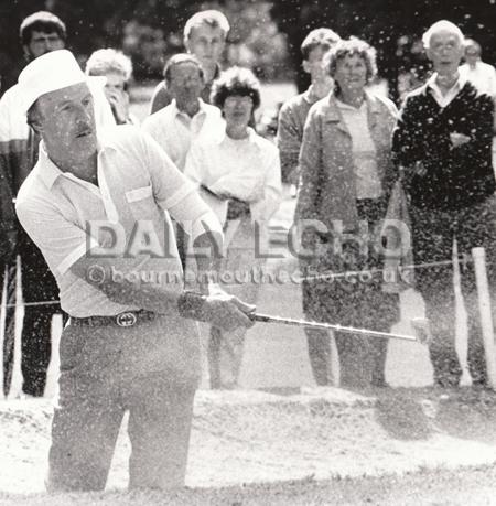 TV presenter Bruce Forsyth in the bunker at the Alliss-Manitou Pro-Am golf tournament at Ferndown Golf Club in 1987. This year he celebrates his 85th birthday.