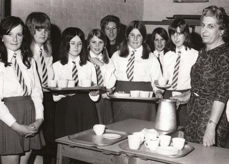 Pupils acted as waitresses at Lytchett Minster C.S.M. School's prize giving supper in 1972.