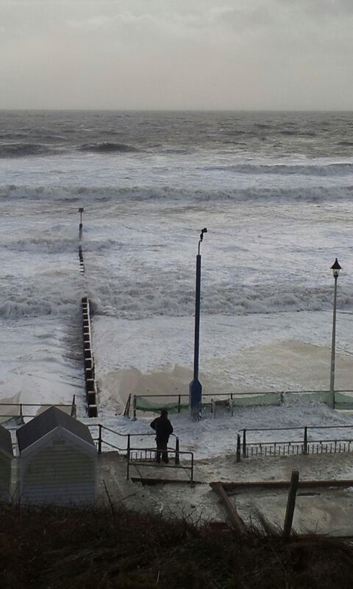 I saw this guy from the cliffs on Southbourne Beach. There is no beach at all. This man was getting wet. Be careful wave watchers. Stay safe!! Picture by Emma Pounds
