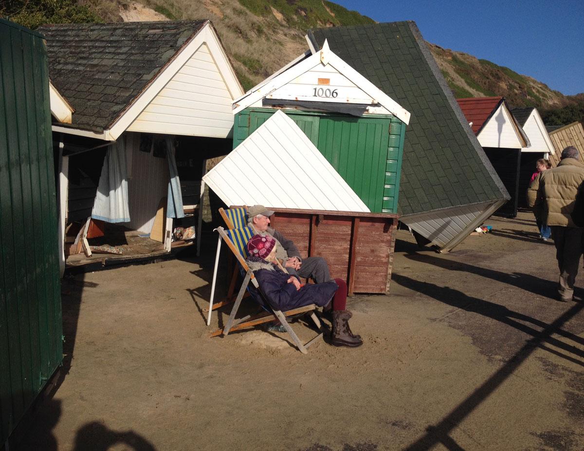 Daily Echo reader photos of the storm and damage left behind after severe weather swept through Dorset on February 14 and February 15. Picture of beach hut owners at Fisherman's Walk sent by Penny Orchard 