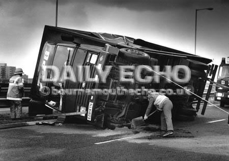 A truck is overturned at Holes Bay in Poole during a storm in February 1990.