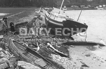 Girls training ship, Hampshire, is driven ashore at Whitecliffe, Poole as 72mph gales leave boats batteed and broken in the gales in 1954.