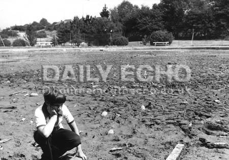 Stephen Bicknell, 11, by the pond at Queen's Park golf course which ran dry for the first time in 40 years during a severe drought in August 1976.
