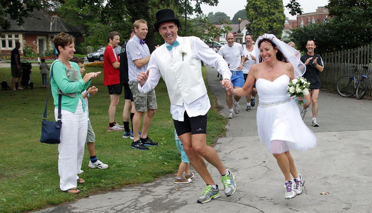 Keen runners Eve Carter and Graham Filmer tie the knot during the Poole parkrun. Photos by Sally Adams. 