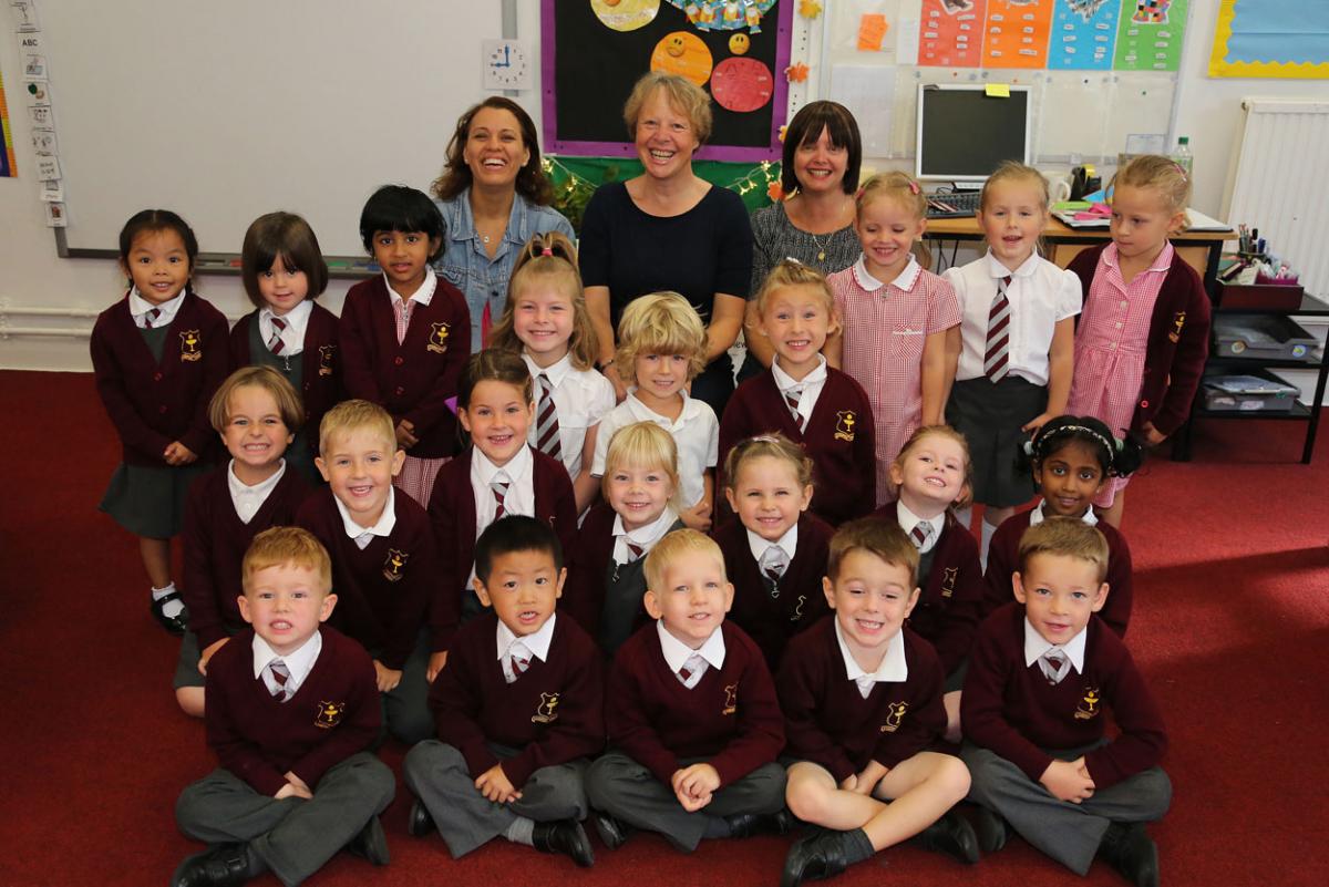 Reception class pupils at Corpus Christie Primary School in Boscombe with, left to right, TA  Daniela Higgins, teacher Katherine Melling and teaching assistant Karen Domeneghetti.  Photo by Corin Messer.