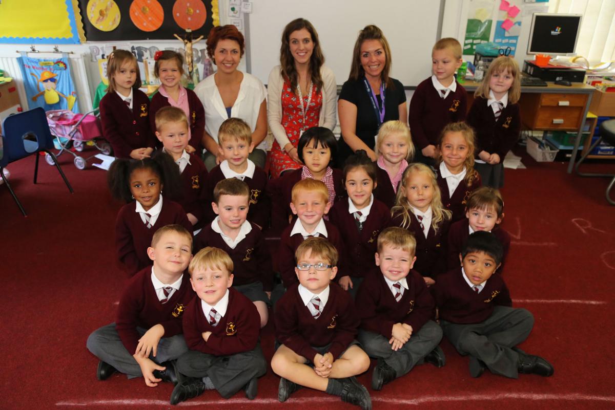 Reception class pupils at Corpus Christie Primary School in Boscombe with, left to right, teaching assistant Kinga Leniarska, teacher Amy Stewart and teaching assistant Paula McFaddon.  Photo by Corin Messer.