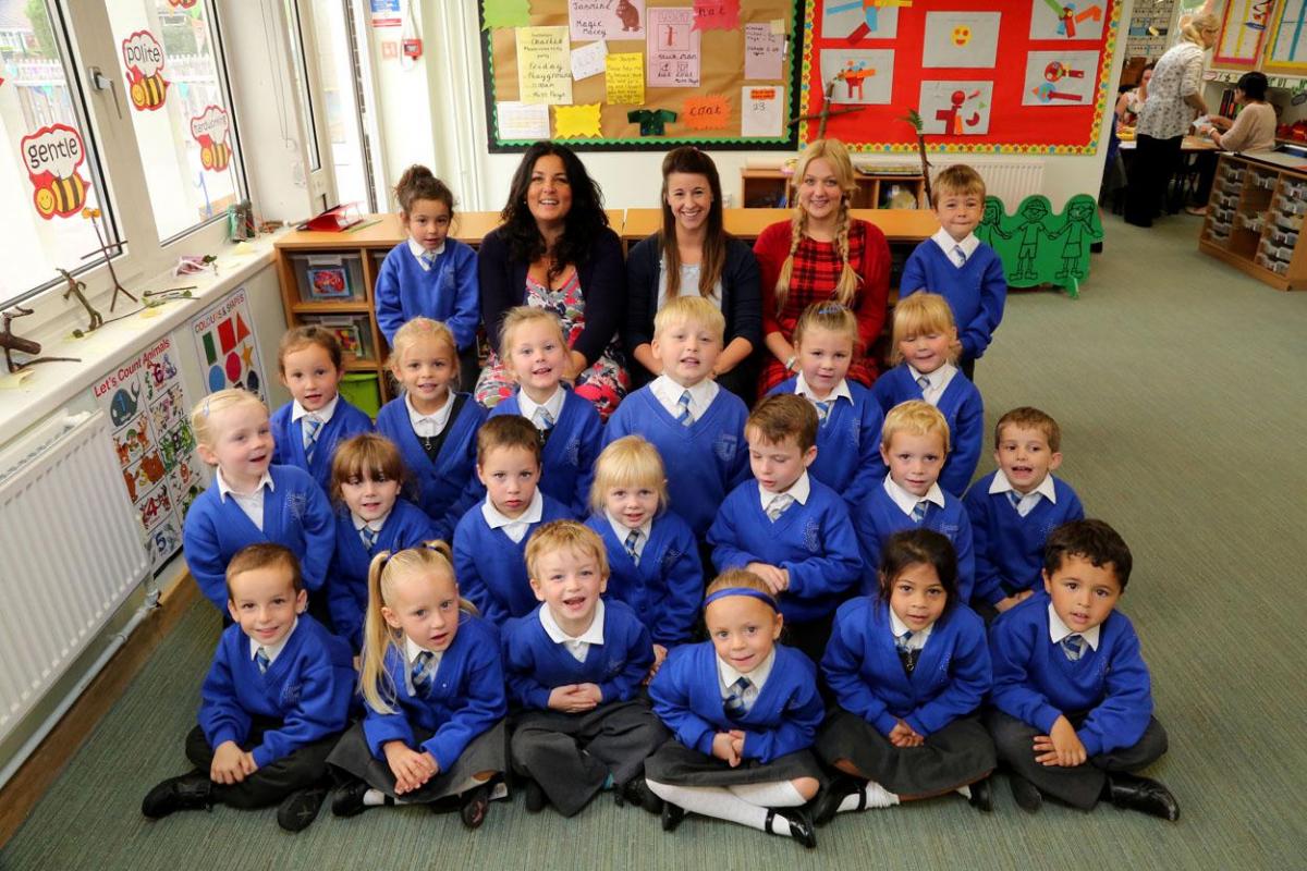 Talbot Primary School reception class pupils with, left to right, head teacher Kate Curtis, teacher Kirsty Lonergan and TA Laura Braden.