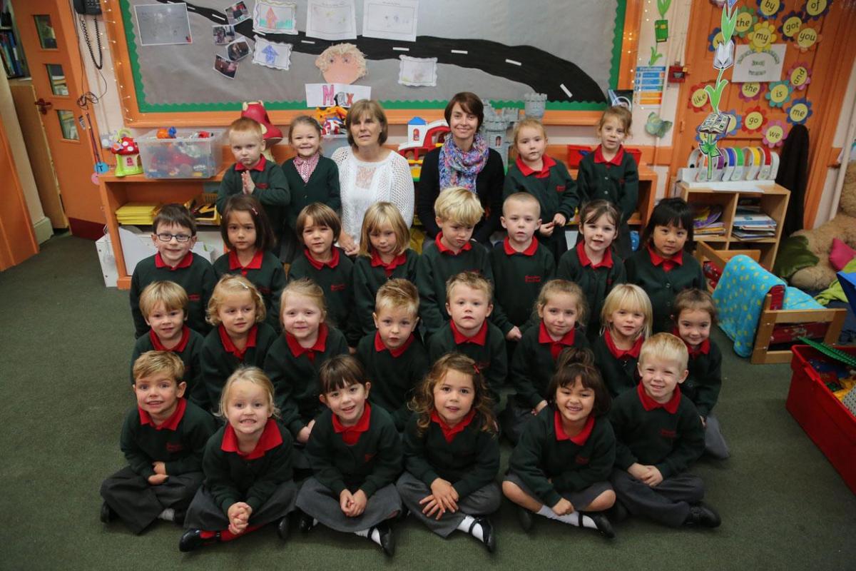 Reception class pupils at Broadstone First School with TA Anne Freeman and teacher Waneen Swart.