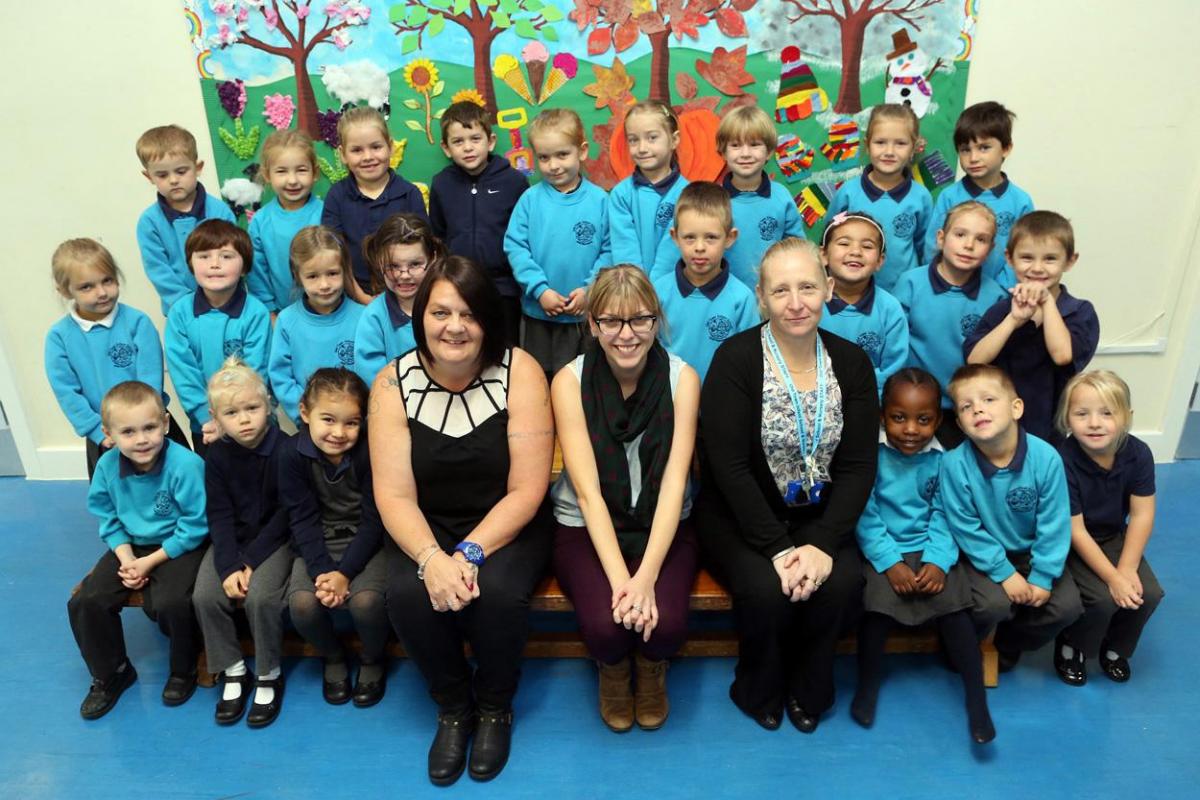 Children from Seahorses class at Old Town Infant School with TA Trace Helier, teacher Louise Hearn, and TA Tessa Cooper.