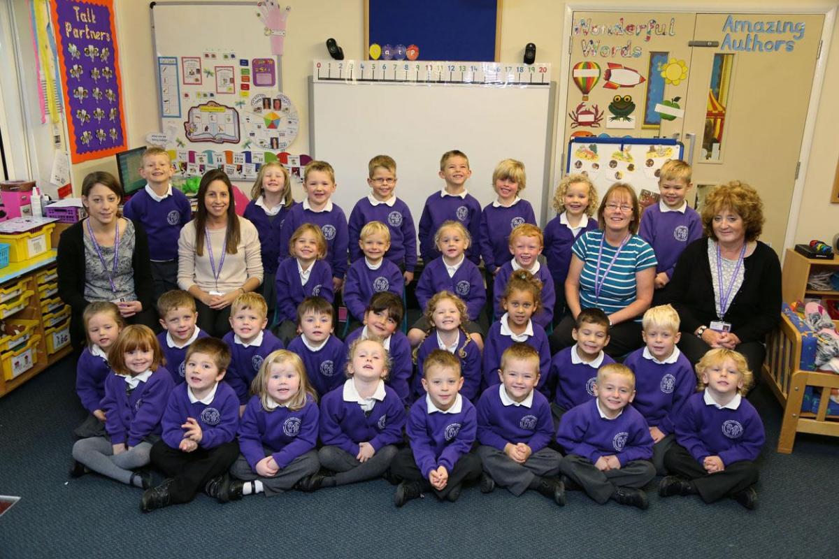 Reception children in Dragonflies class at Canford Heath Infant School with student teacher Becky Davies, teacher Lucy Wood and TA's Kim Heeks and Barbara deCosta.