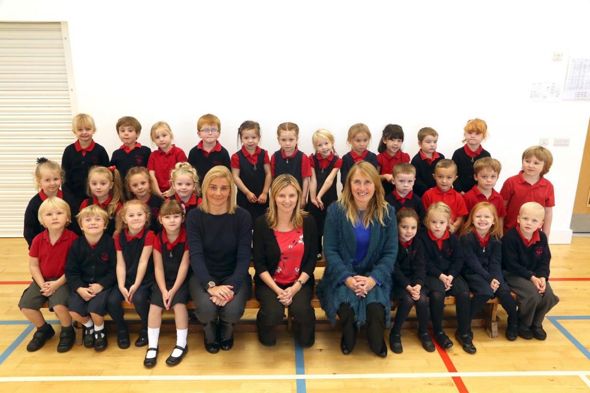 Penguin Reception Class at Christ The King RC School with TA Liz Hill, and teachers Marie Bunford and Kathryn Boniface.
