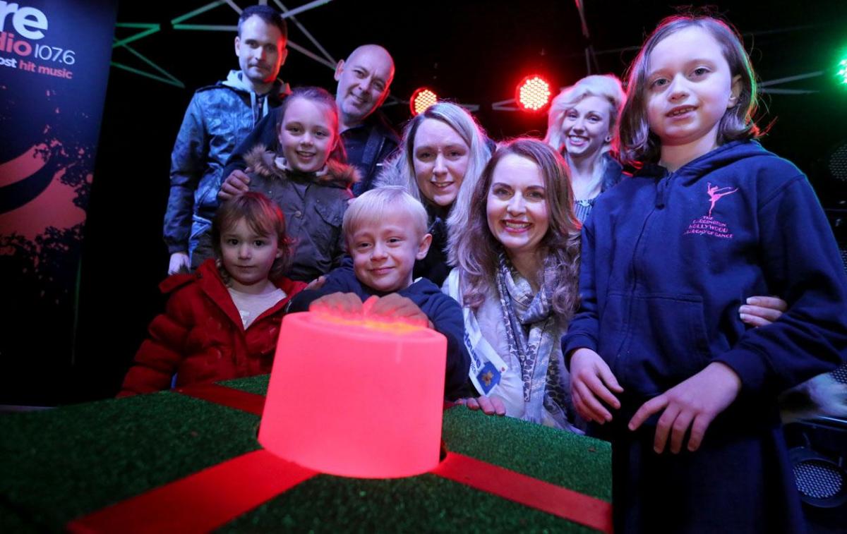 Debra Stephenson helps switch on the Christmas lights at Poole's Dolphin Shopping Centre. Pictures by Corin Messer. 