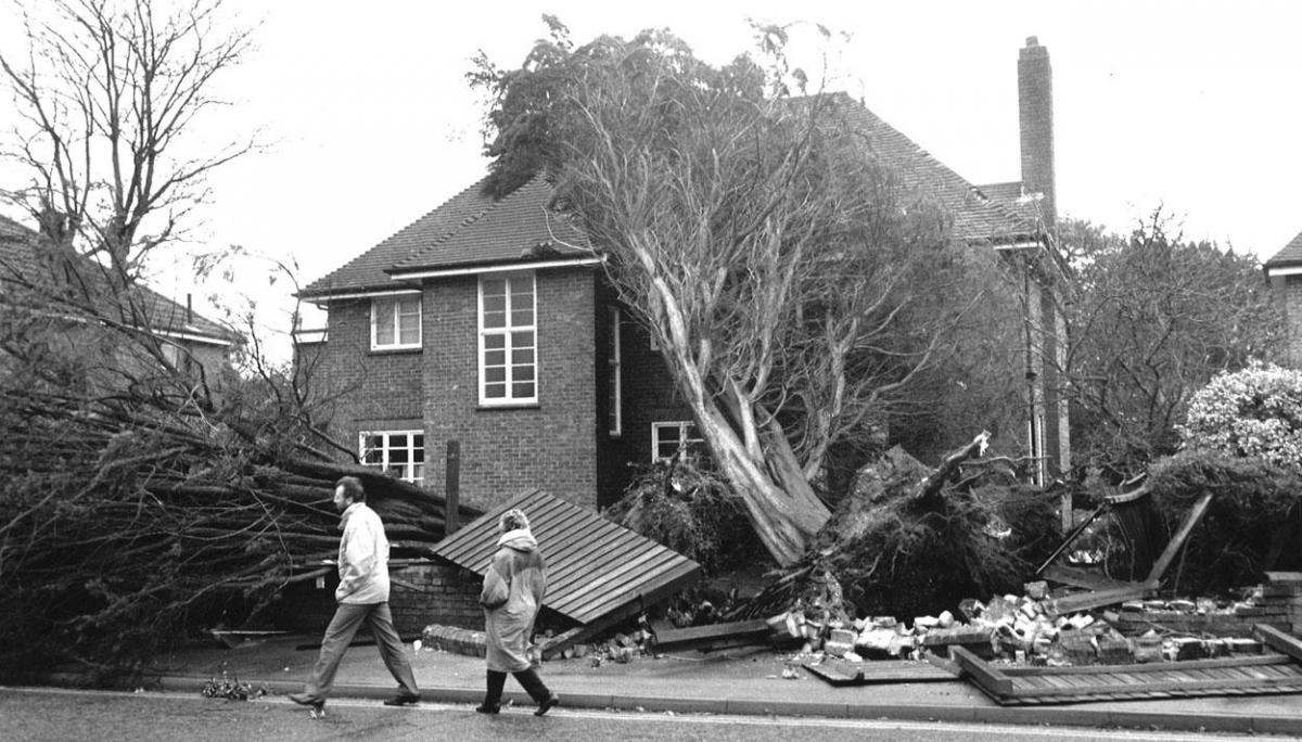 A giant tree crashed into the roof of a house in Wimborne Road during the 1990 gales. 

