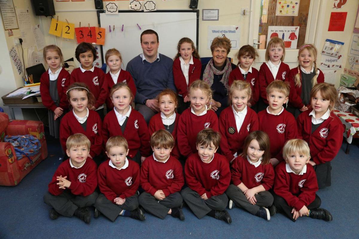 Reception class pupils at St Nicholas Primary School in Child Okeford with teacher James Maitland and TA Janet Wingrove. 