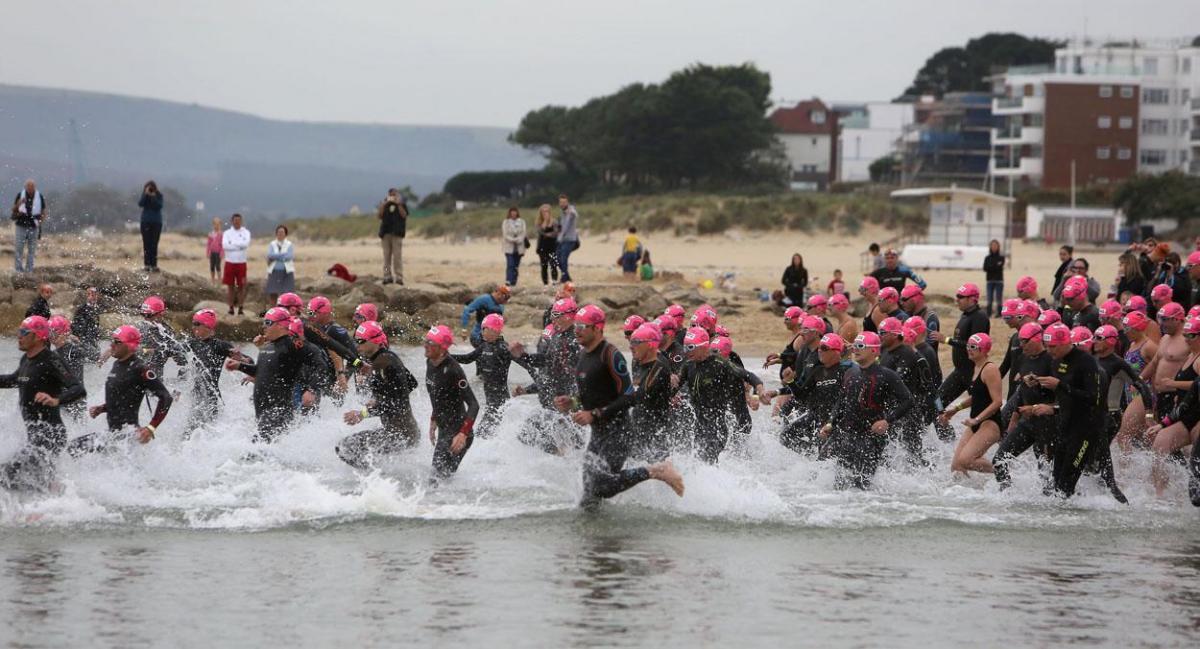 Swimmers taking part in the Poole Open Water swim off  Sandbanks beach in September 2014. Picture: Richard Crease, Bournemouth Daily Echo