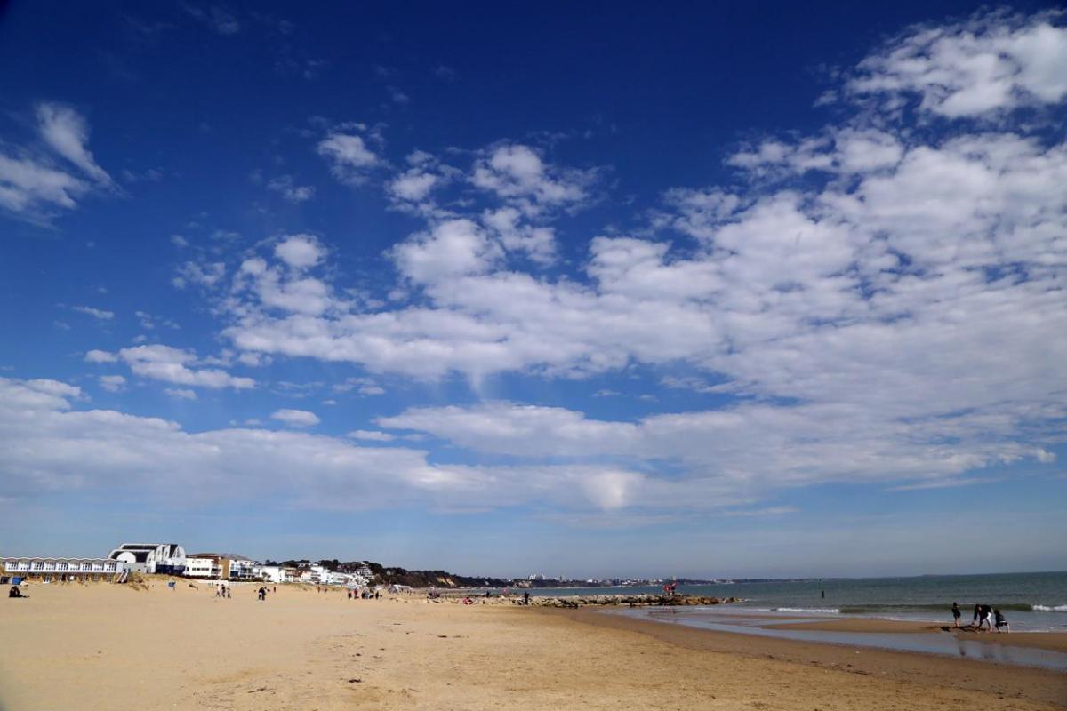 Enjoying  Sandbanks beach on a warm March day by Richard Crease, Bournemouth Daily Echo.
