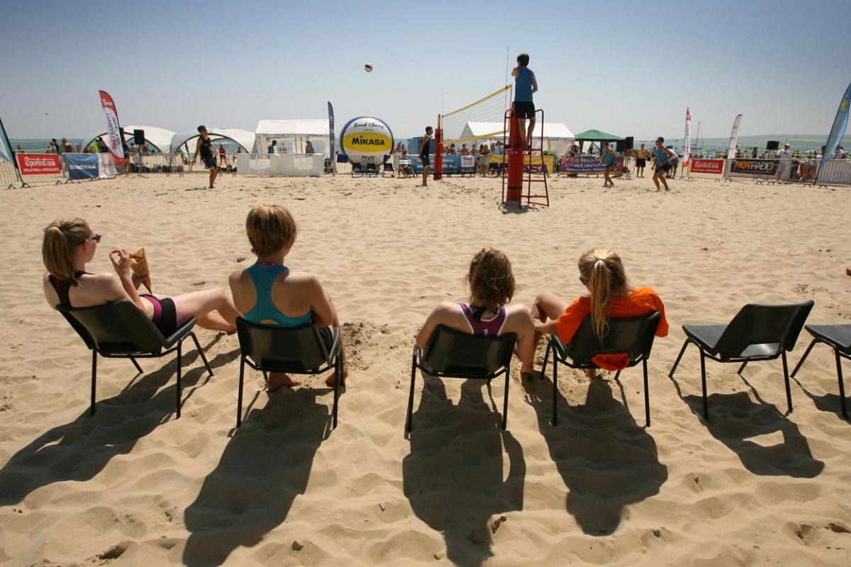 Sandbanks Beach Volleyball Festival.   spectators watch an Under 20's game in July 2013