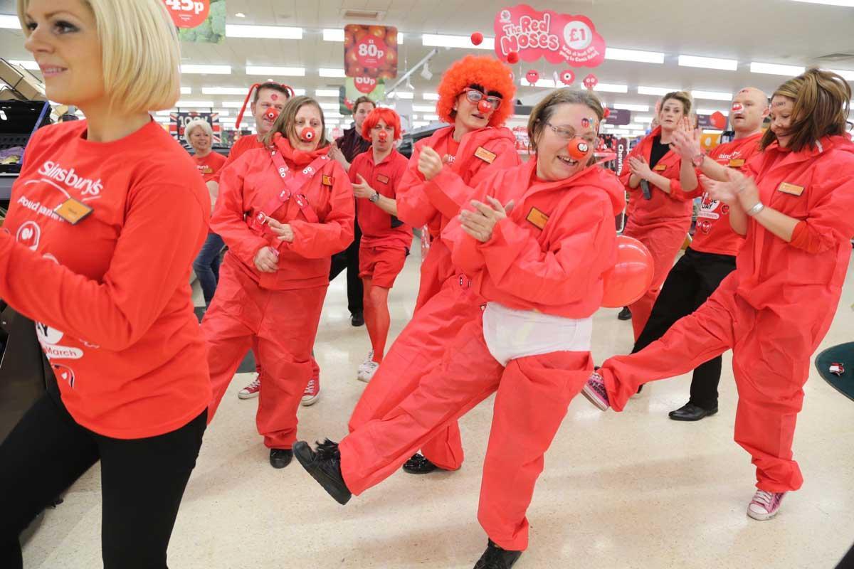 Staff and volunteers at Sainsbury in Ferndown dance to raise cash for Red Nose Day.